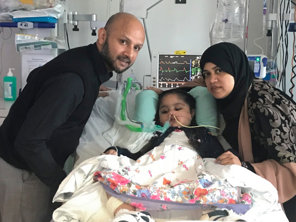  Dad Mohammed and mum Shelina with Tafida at the Royal London Hospital in Whitechapel