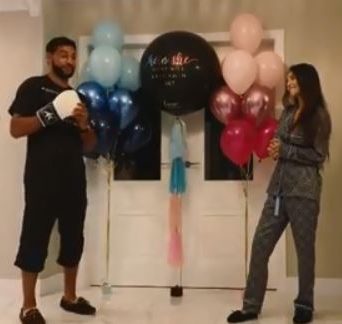  Amir revealed their third child was a boy by belting a balloon