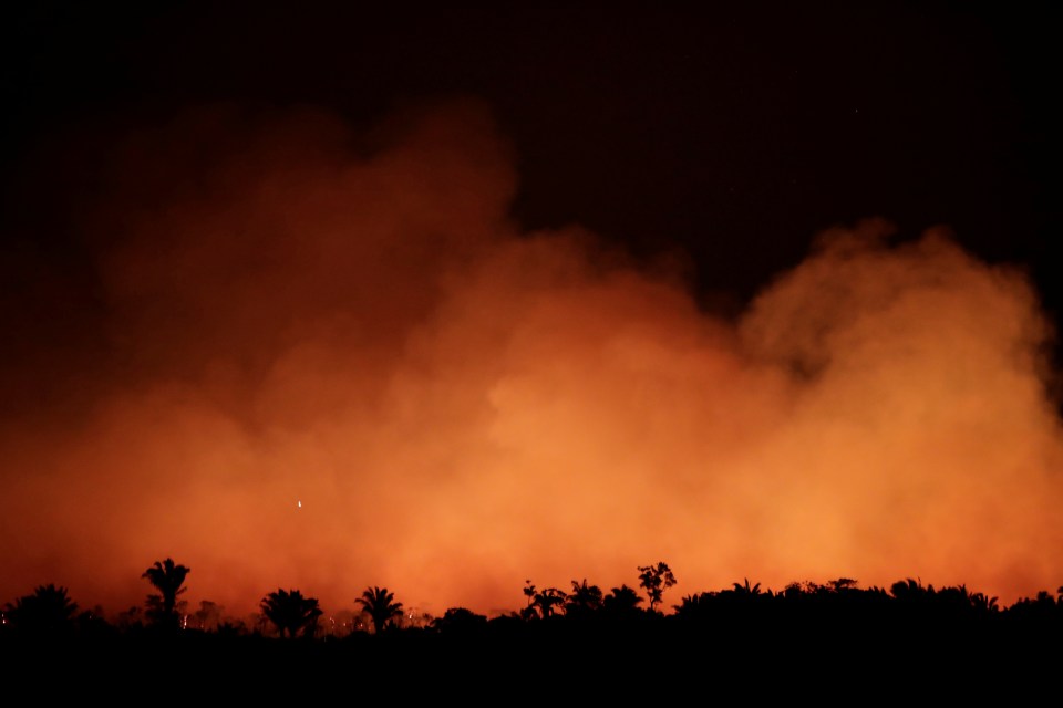  Smoke billows during a fire in an area of the Amazon rainforest near Humaita, Amazona state