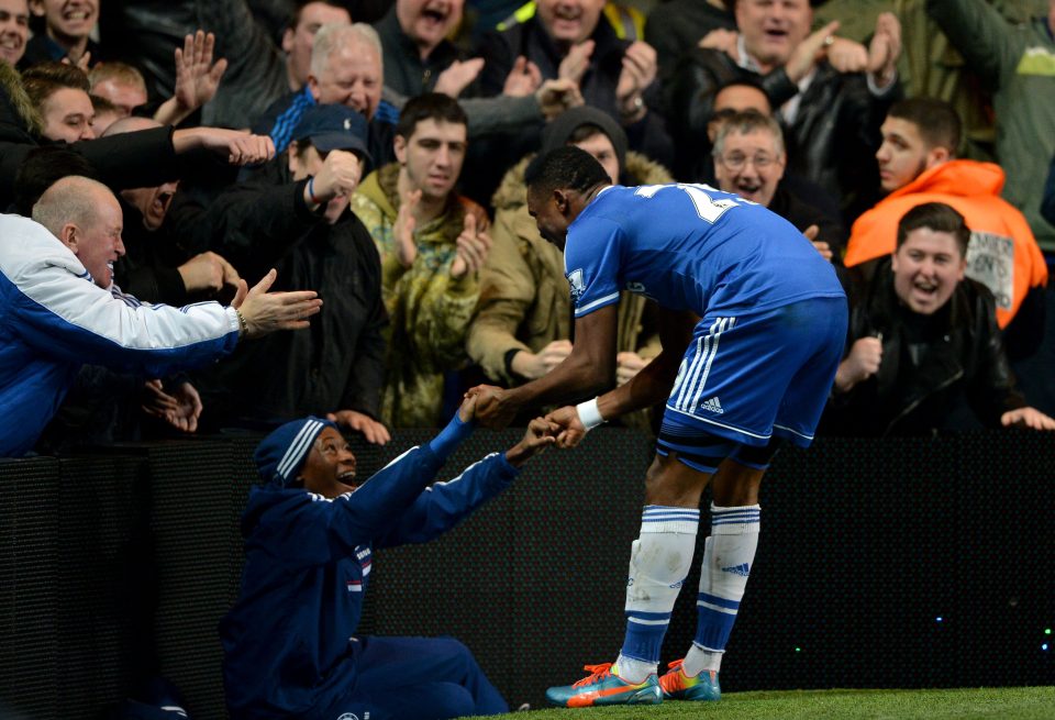 Samuel Eto'o celebrates with a 13-year-old Callum Hudson-Odoi who was a Chelsea ball-boy