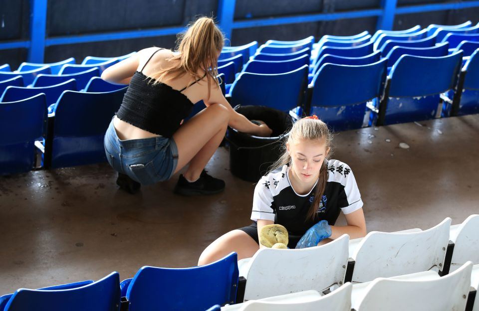  Volunteers arrived at Bury's home ground to wash the seats down in hope rather than expectation