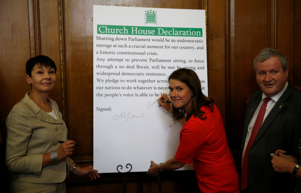  Jo Swinson with Caroline Lucas and Ian Blackford signing the declaration