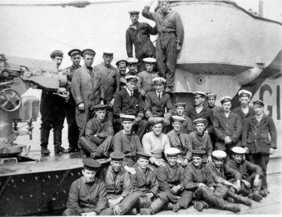  Captain Maurice Bailward surrounded by his crew on submarine G14