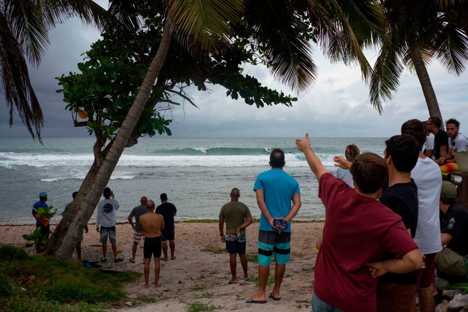  People gather on the beach at Patillas in Puerto Rico as Dorian hurtled towards the Caribbean island