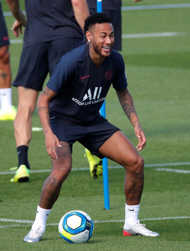  Neymar looked in high spirits as he joked around with his team-mates