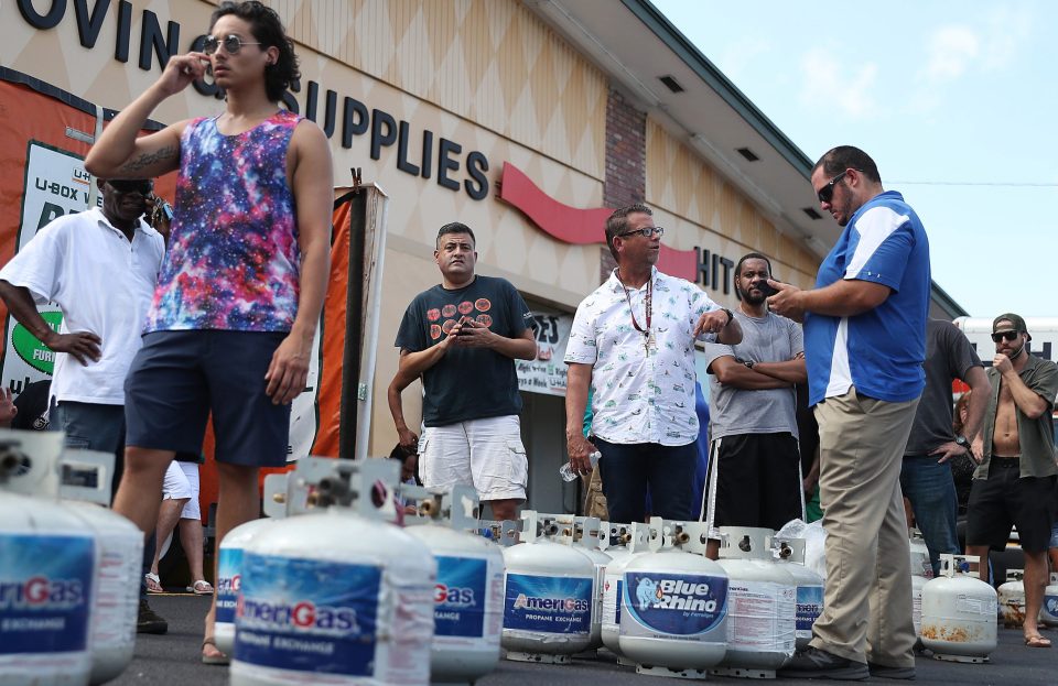 Locals queue up to refill their propane tanks for their generators