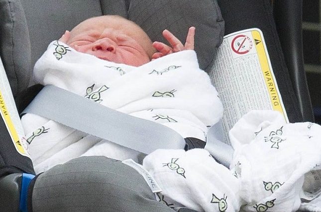 Prince George was swaddled in an Aden + Anais wrap as Prince William carried him to the car