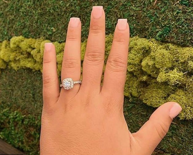 A woman has been slammed by Facebook users for pictures of her engagement ring