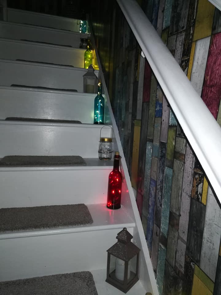 She painted the stairs with a gloss paint and stuck carpet on top