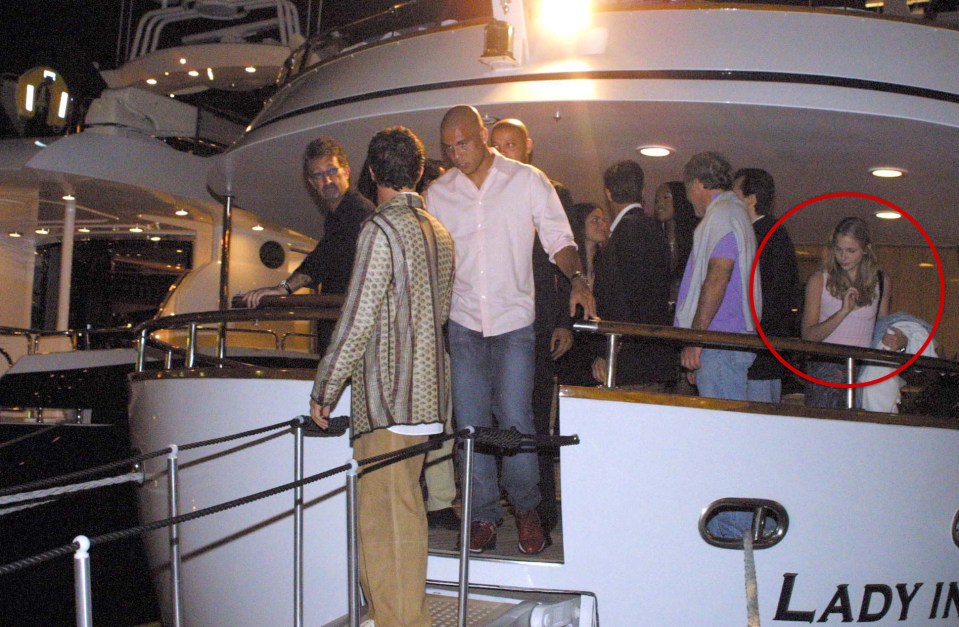  Newly unearthed photos appear to show Virginia Roberts, then aged 17, on board a luxury St Tropez yacht with Jeffrey Epstein, believed to be to the left of her in blue, at Naomi Campbell's birthday party in 2001