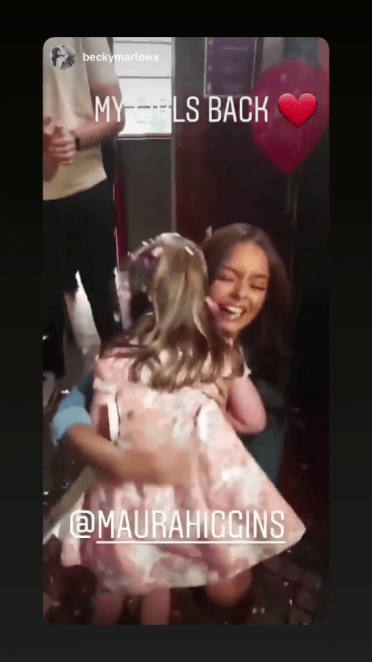  Maura embraced a little girl