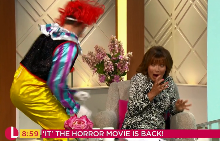  The TV host screamed loudly as she was surprised by the frightening creature