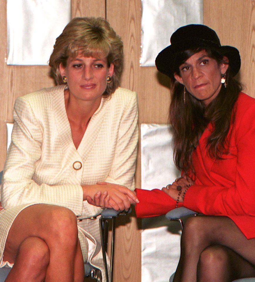 Princess Diana shakes hands with Aileen Getty in July 1996, who is HIV positive