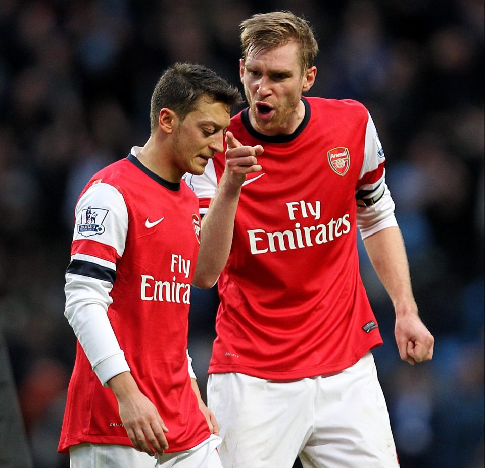  Per Mertesacker and Mesut Ozil played together for club and country