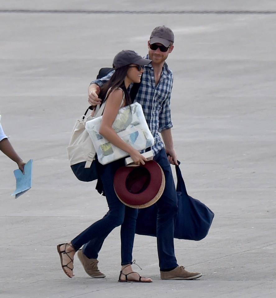 Harry and Meghan at the airport in Africa in 2017