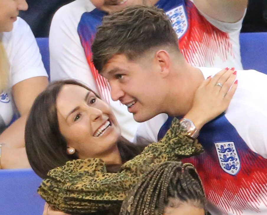  Millie and John looked loved up at last year's World Cup