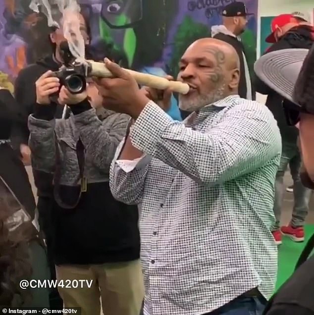 Mike Tyson was spotted smoking a foot-long joint at a marijuana event