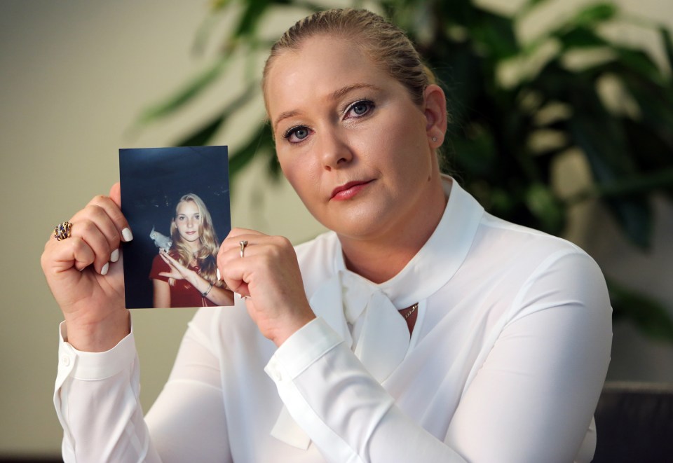  Virginia Roberts holds a photo of herself at 16, when she alleges Epstein began abusing her