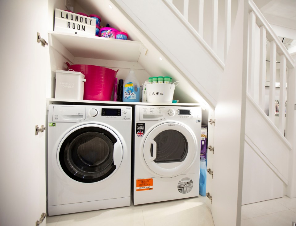  The under stairs cupboard has been transformed into a mini utility area