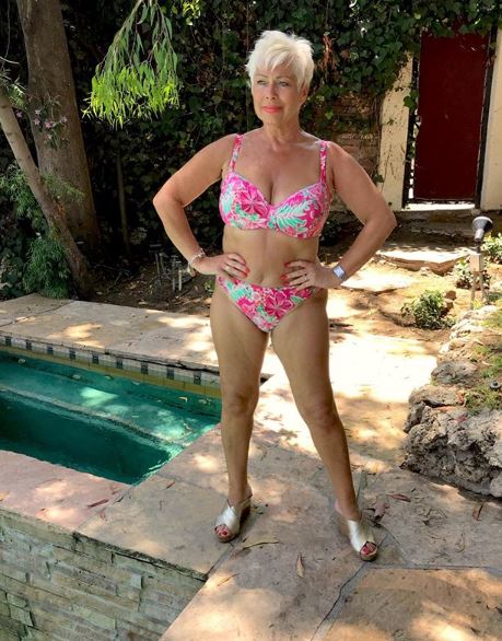 Denise Welch stuns in a pink floral bikini