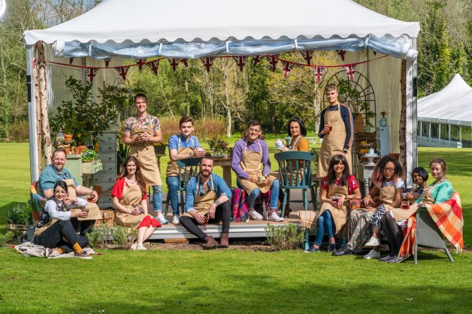 Jamie, standing right, with The Great British Bake Off contestants by the famous tent