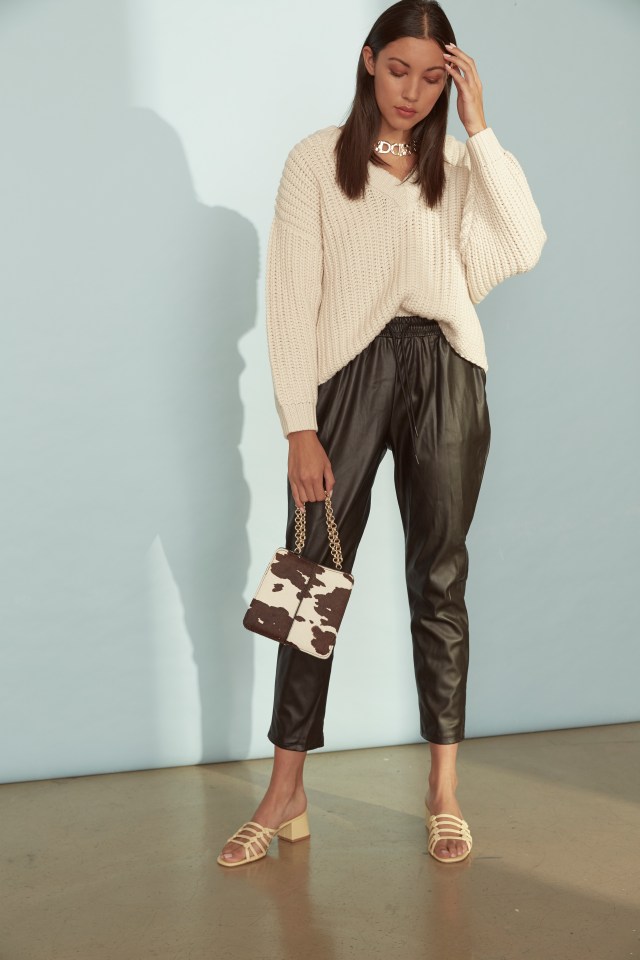  TIP: Give your outfit a designer look by clashing textures, like these leather-look trousers with an oversized knit