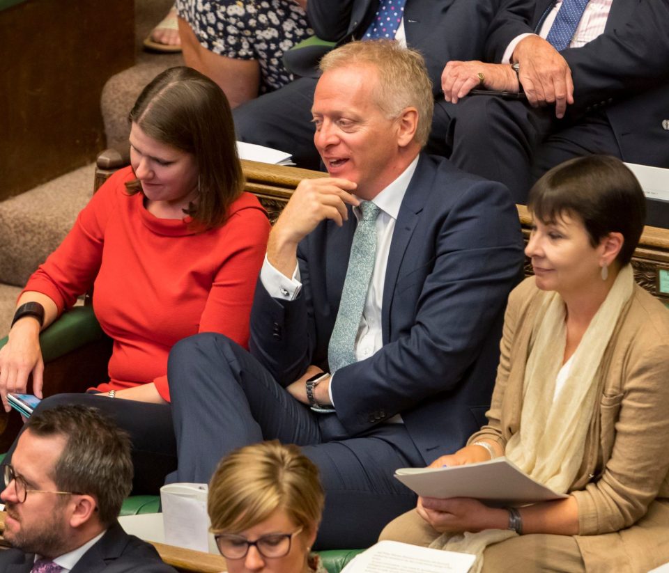  Phillip Lee, centre, smirks after pulling off his defection stunt during dramatic scenes in Parliament