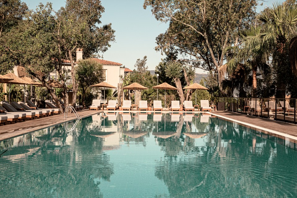  The hotel's chic pool with its stylish wicker parasols