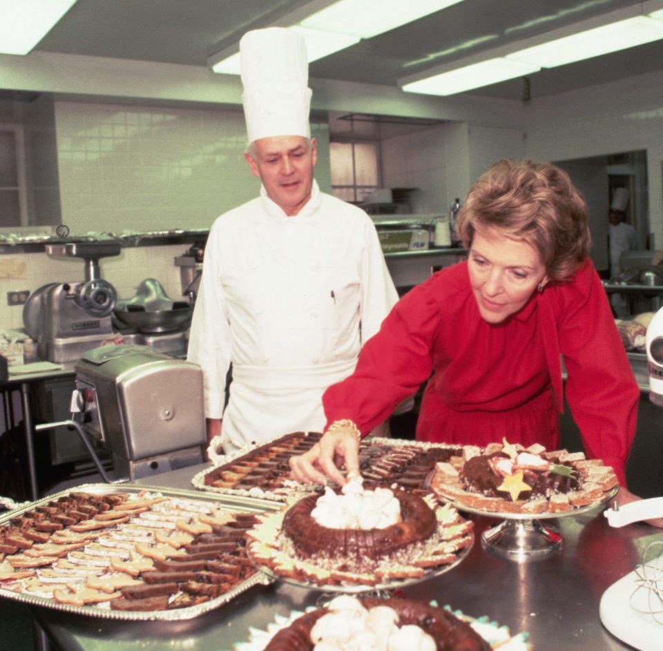  Then-first lady Nancy Reagan checks on the preparation of desserts in the Chocolate Shop