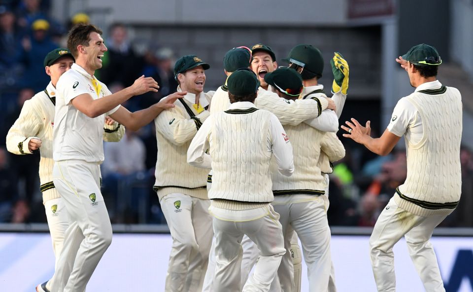  Australia celebrate after removing Joe Denly in the evening session