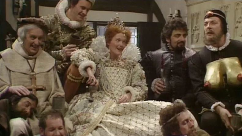  Scene from a Blackadder series two episode with Miranda Richardson as Queenie and Stephen Fry as Melchett sporting a pair of fake tits