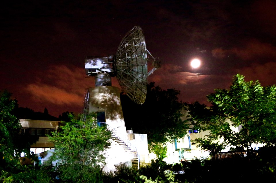  A radar scans the skies with the moon in the background at the Isra Telemetry, Tracking and Command Network in Bangalore