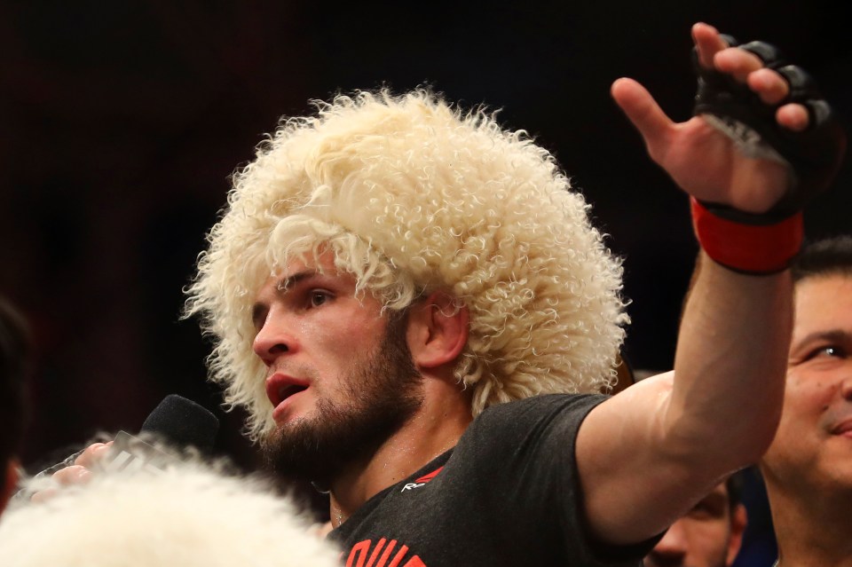  Khabib Nurmagomedov celebrates victory in his traditional sheepskin Papakha hat