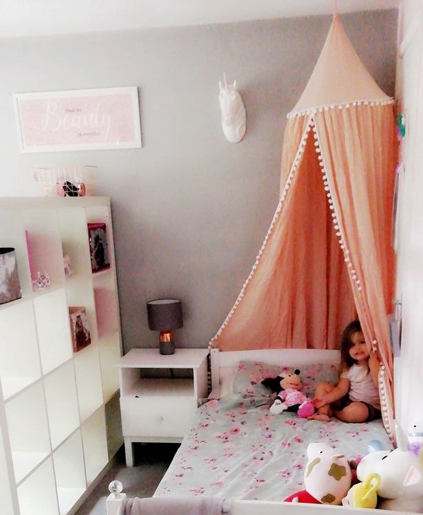 It allowed her to set up two different areas for each of her daughters while creating extra storage