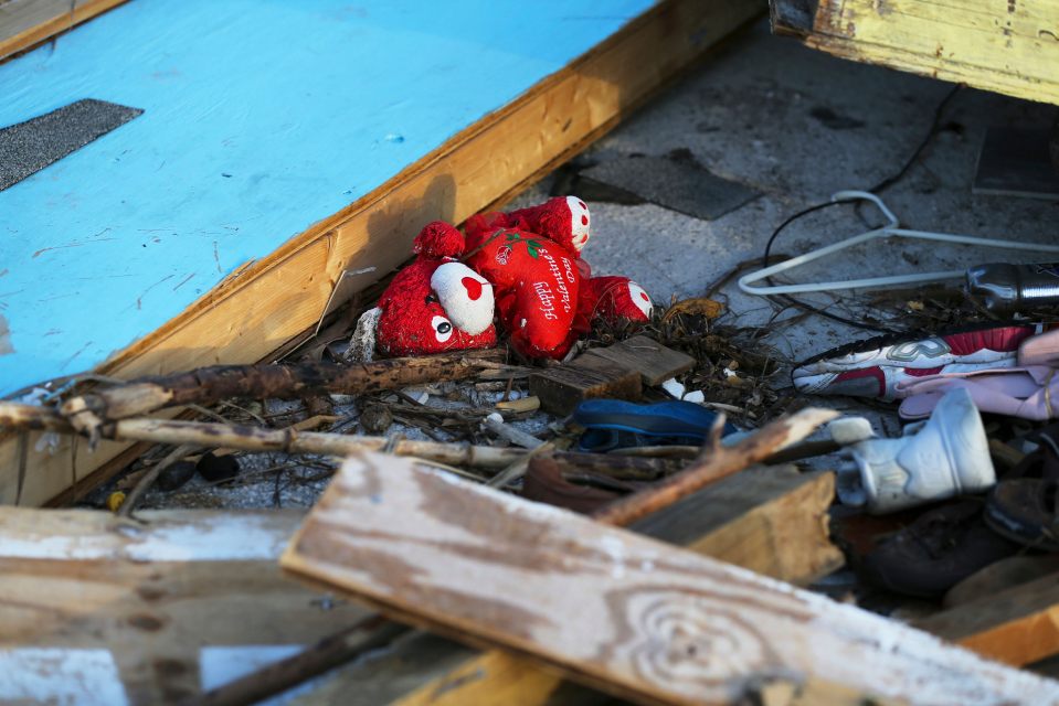  A teddy lies amid the debris of a collapsed home