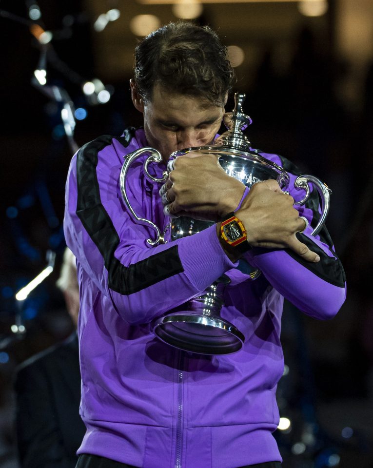  Rafa Nadal clutches his prize after a roller coaster final