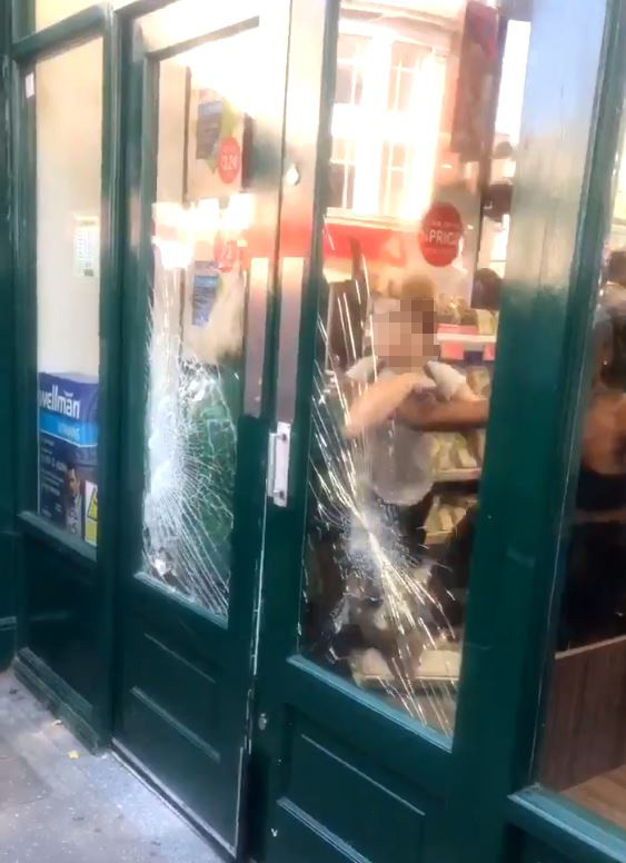  A Holland & Barrett employee being attacked by a gang of girls who were allegedly trying to leave the shop with stolen goods