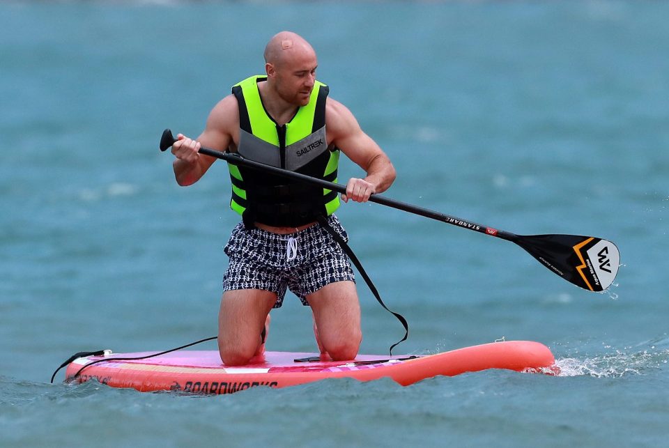  Willi Heinz spends some time relaxing on a paddleboard as England make their final preparations for the tournament