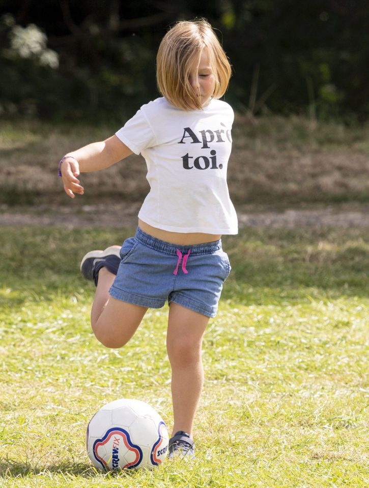  The couple were joined by daughter Mia, who could be seen practising her football skills