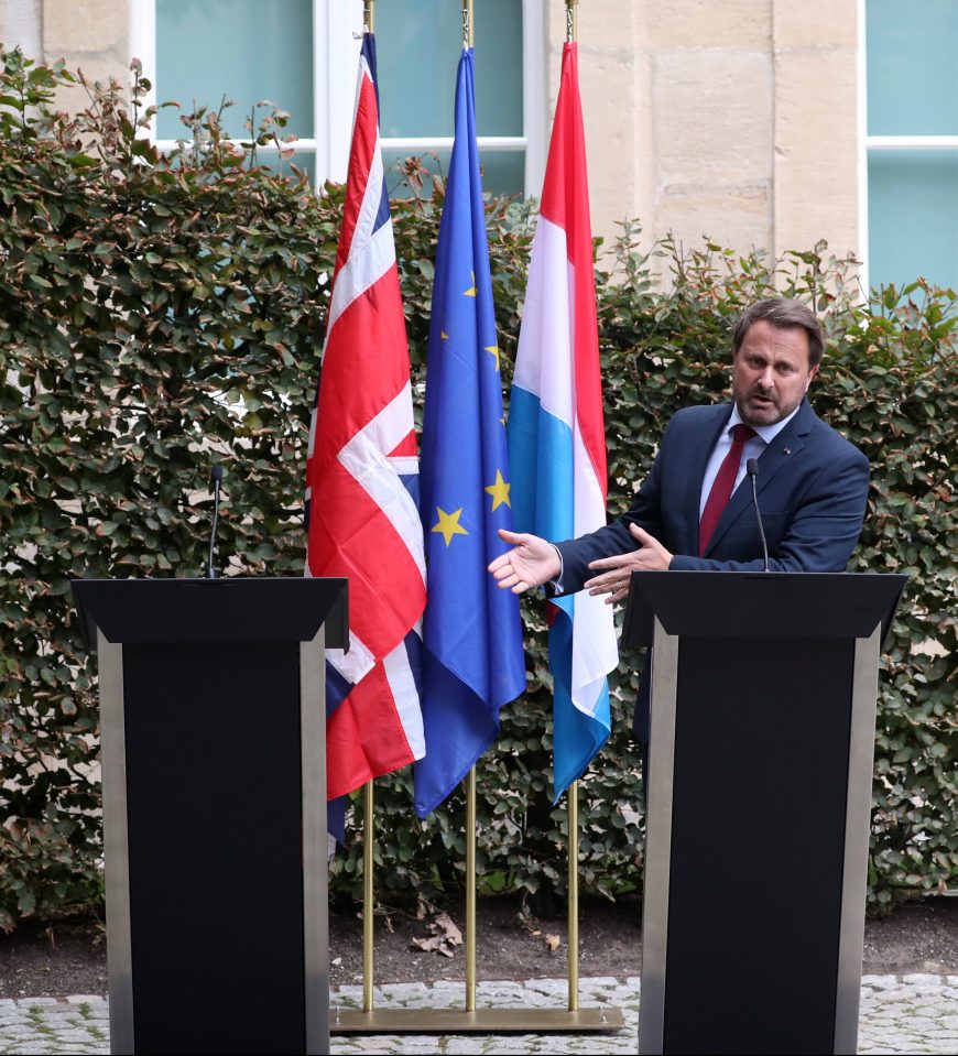 Xavier Bettel was accused of egging on the mob as he stood by the empty lectern