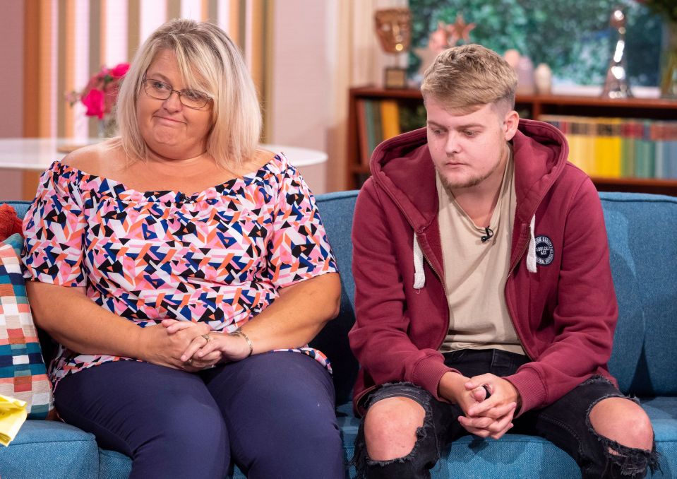 A mother and son sit on a sofa, discussing the son's vision loss due to poor diet.