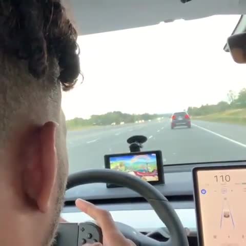  A screen was mounted on the windscreen of what appeared to be a self driving car