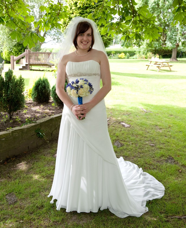 Martha poses in her £995 Sophia Tolli wedding gown