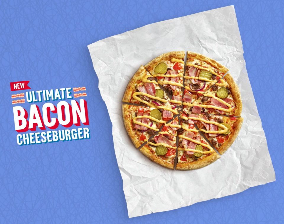  The fast food creation is a deconstructed burger spread across a pizza base, complete with mozzarella and bacon