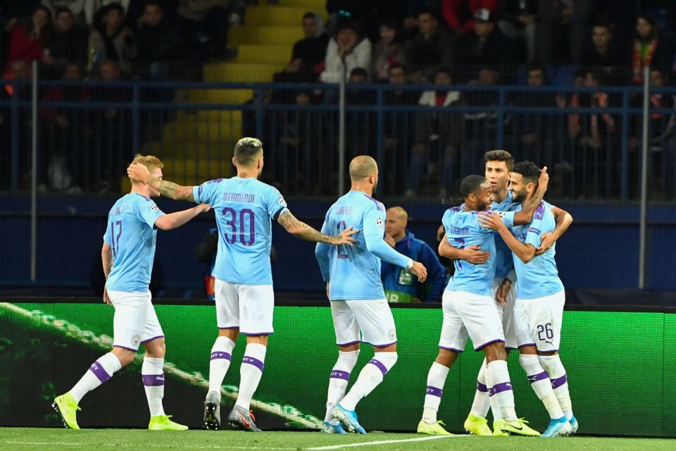  City's players celebrate during their routine win at Shakhtar