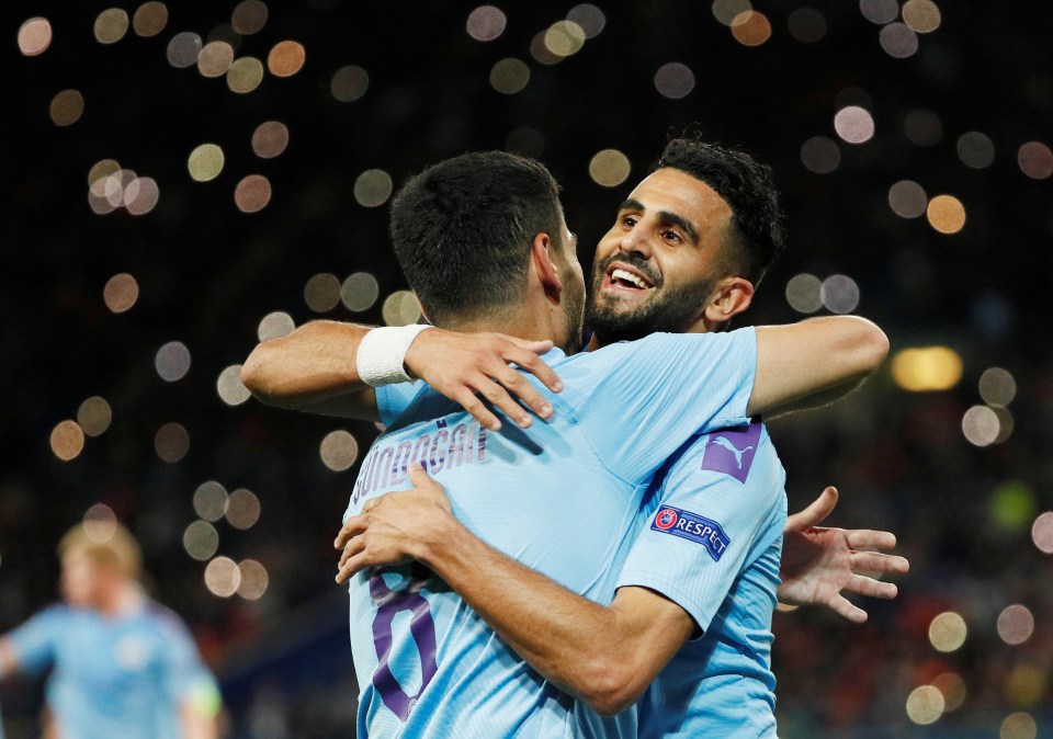  Man City goalscorers Ilkay Gundogan and Riyad Mahrez celebrate during their team's win in Ukraine