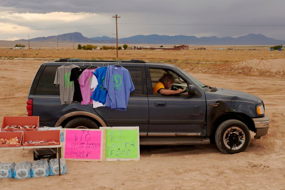  Leslie Harbor from Memphis, Tennessee, sits in his car waiting for customers to buy T-shirts at the Alienstock festival hosted by the Little A'Le'Inn on the Extraterrestrial Highway in Rachel, Nevada