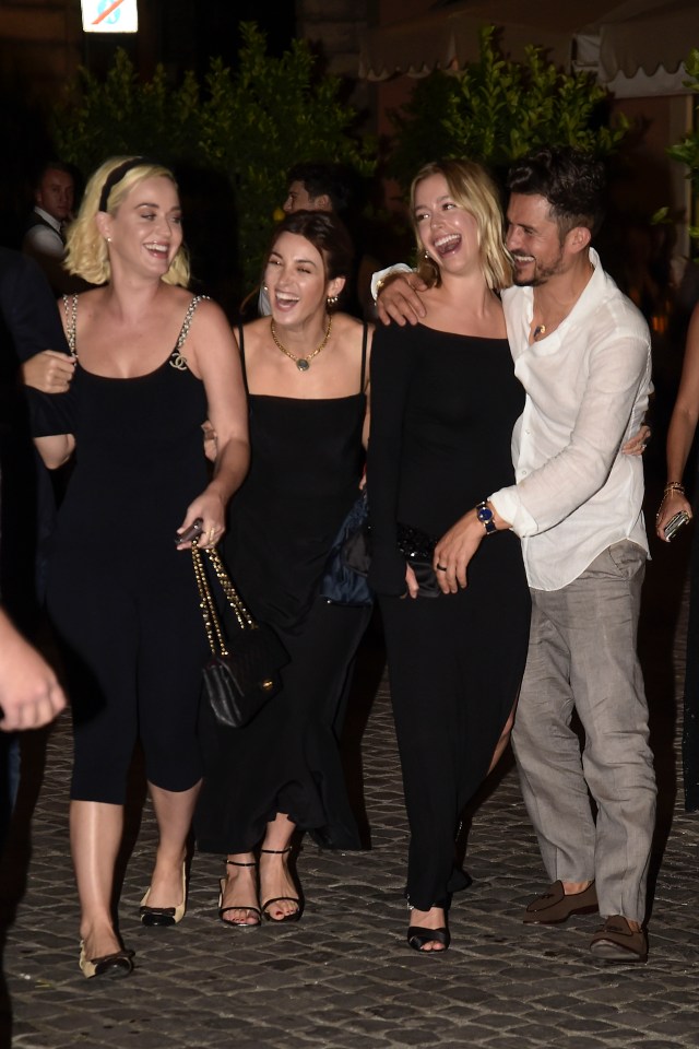 Katy Perry, left, and Orlando Bloom party with pals at Misha Nonoo and Michael Hess’s pre wedding dinner at Pierluigi’s in Rome