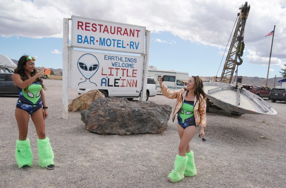  Two girls do a live stream for a podcast at Little A’Le’Inn, site of Alienstock music festival in Rachel, Nevada