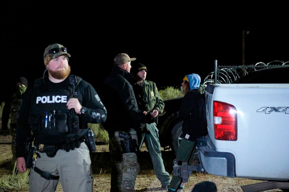  At least two people were detained by local sheriff's deputies at a gate to Area 51 in Nevada after an estimated 75 people gathered at the site early Friday